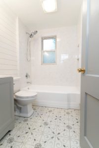 This image features a white bathtub. 